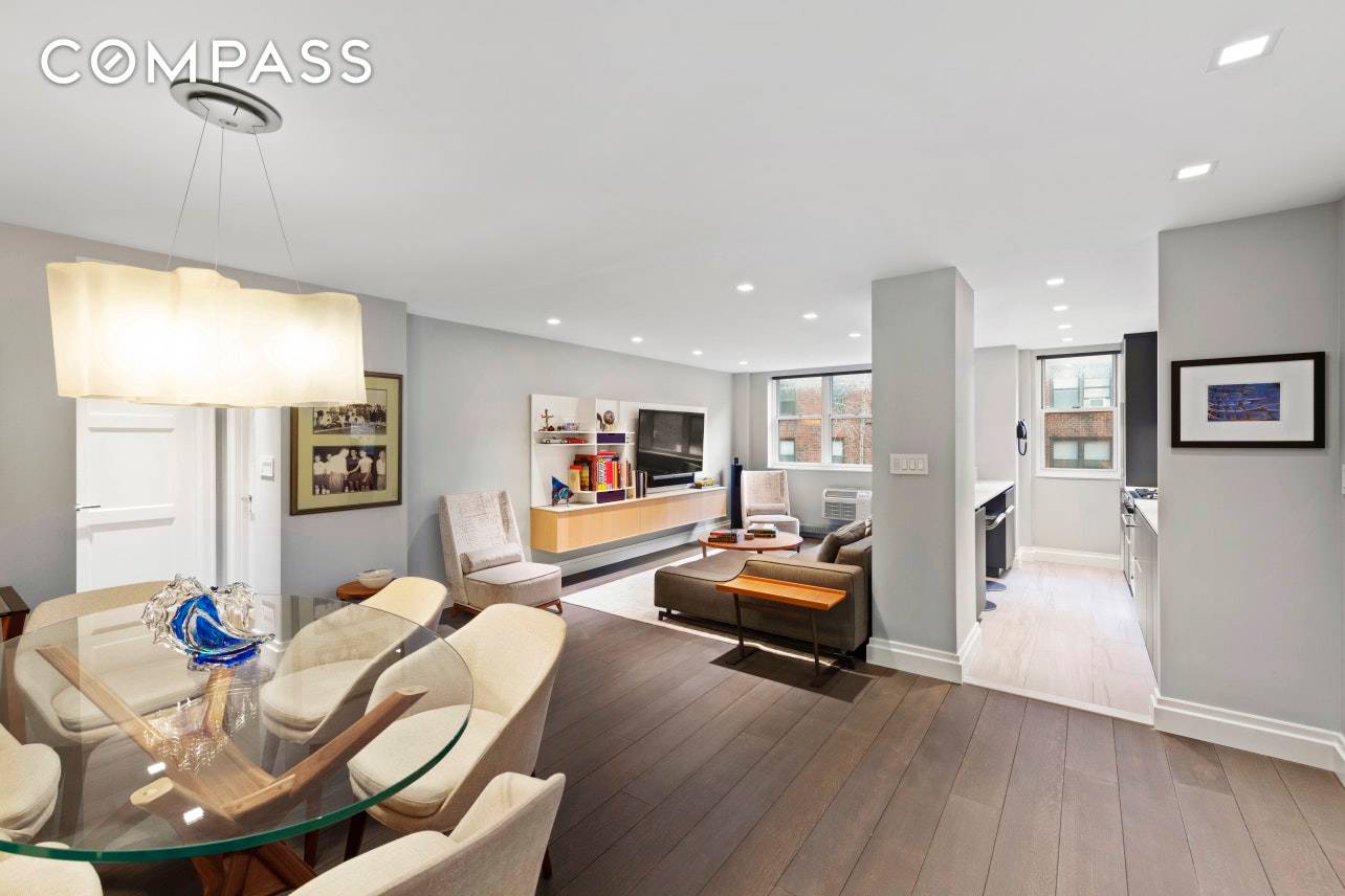 Designer renovated, enormous and sunny, one bedroom home with a separate dining area and bar at the full service Randall House condop in Greenwich Village.