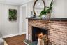 Modern charm meets rustic texture in this cozy focal point, perfect for curling up on cool evenings.