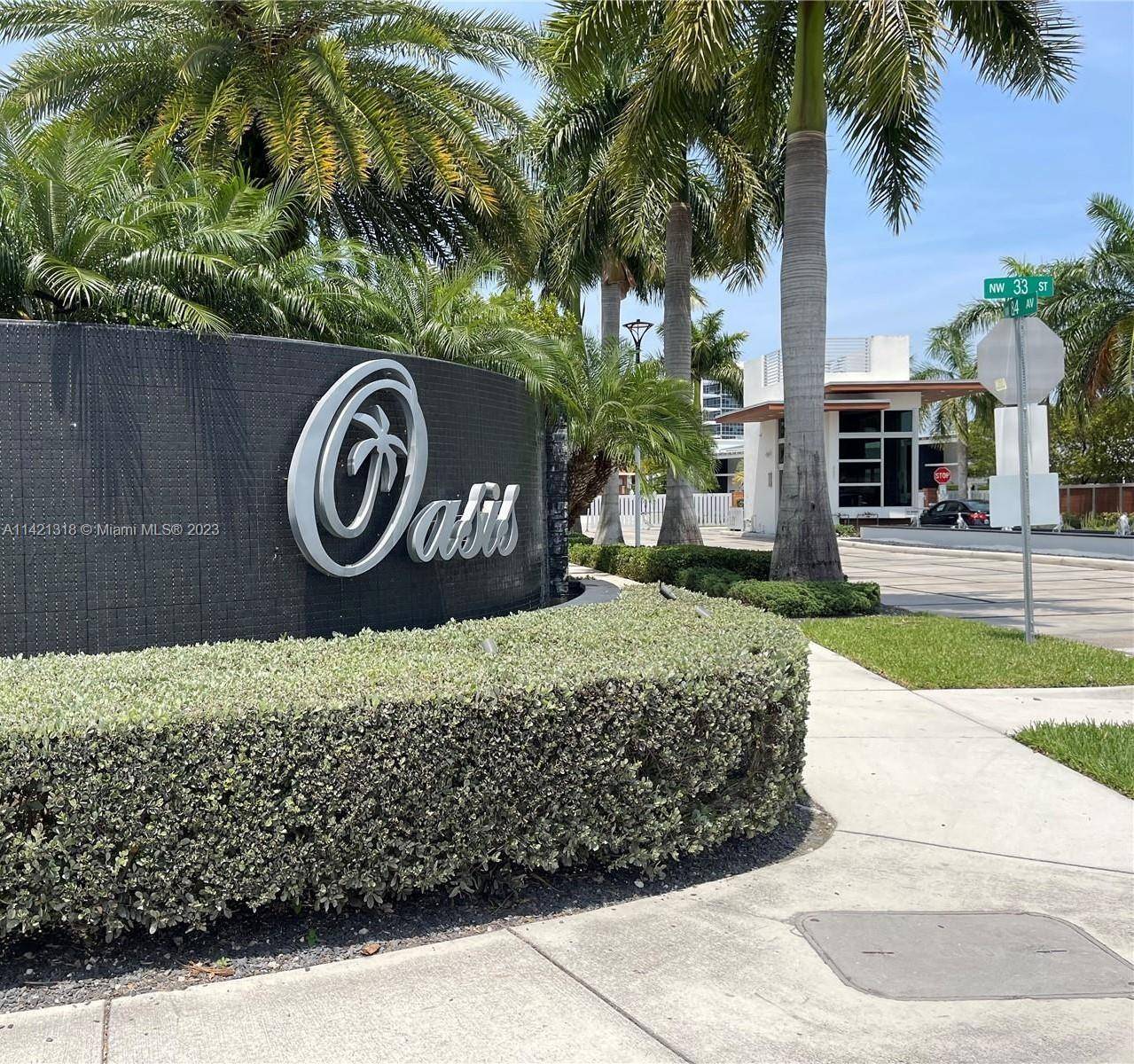 A one of a kind Must SEE Experience this luxurious, modern home in Oasis at Doral a gated 24 hour patrolled community.