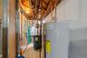 Utilities featuring gas water heater and a heating unit
