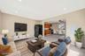 Living room featuring recessed lighting, light tile patterned flooring, a ceiling fan, and electric panel