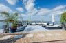 View of property's community featuring a water view and an outdoor living space