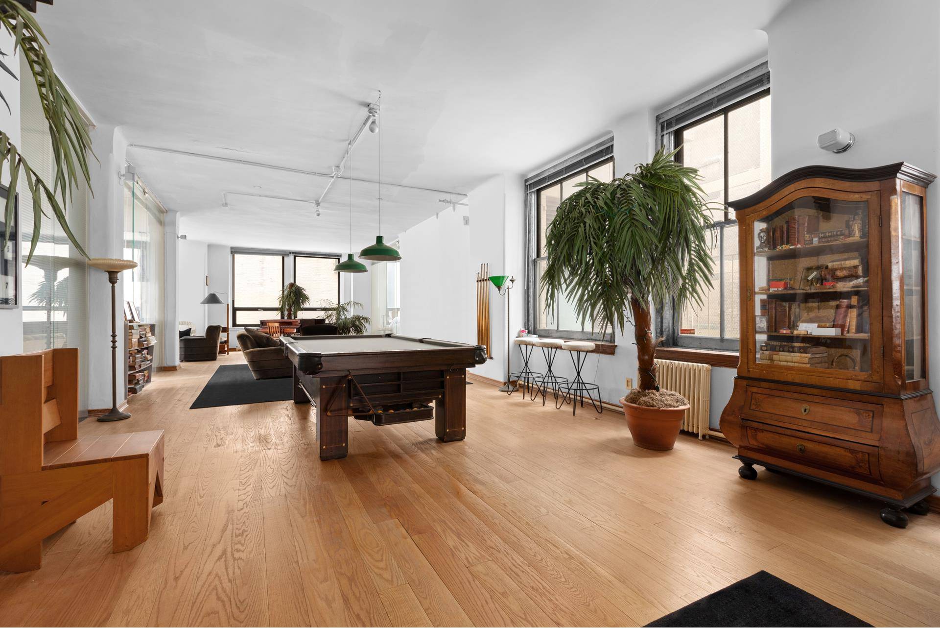 Discover a rare find at 50 Pine Street, Apartment 10 a genuine old school artist's loft tucked away on a quiet street in Manhattan's historic Financial District.