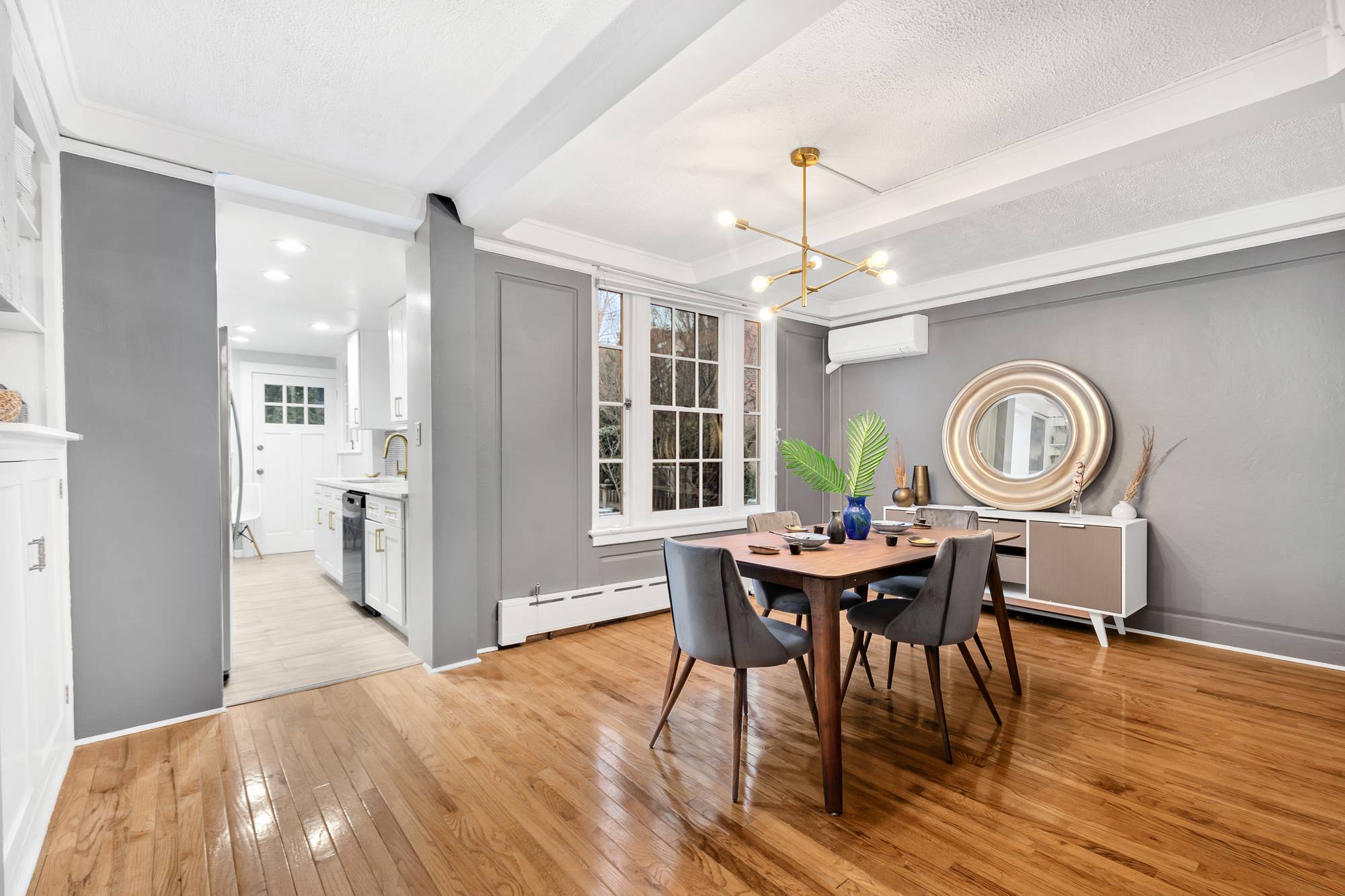Discover this newly renovated four bedroom two and a half bathroom Tudor townhouse, nestled on a tree lined block in the private community of Forest Hills Gardens.