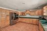 Spacious kitchen featuring solid wood cabinetry and generous countertop space