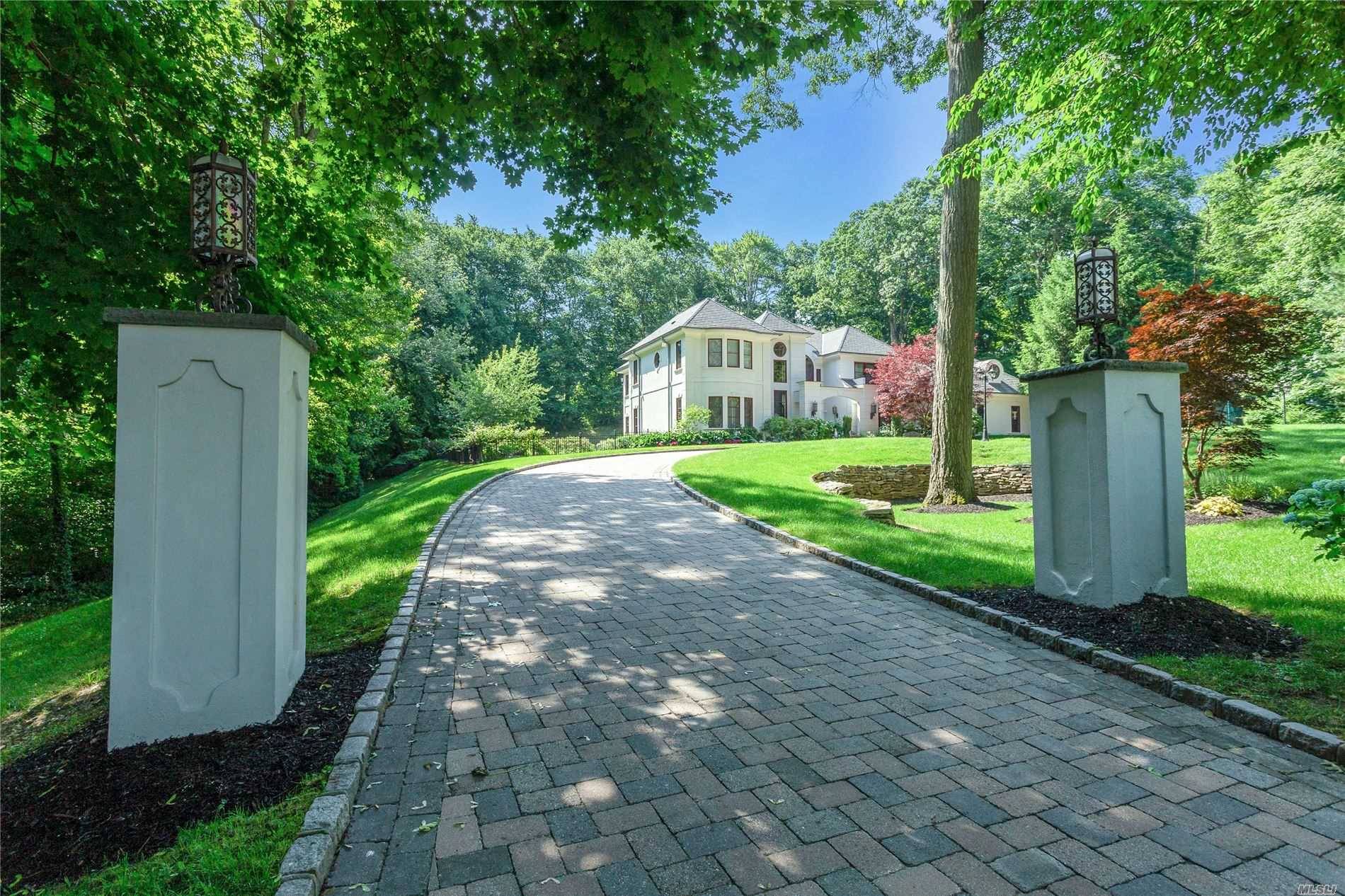 BROOKVILLE. Unmatched Stucco Colonial Located on Over 2 Private Acres In The Village of Brookville.