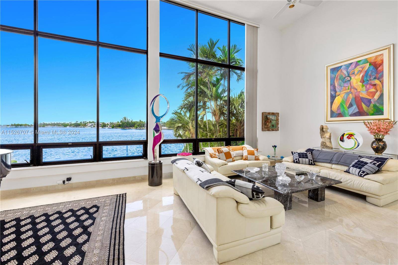 Imagine waking up to panoramic WIDE BAY VIEWS from your double height living room on prestigious SECURED Hibiscus Island.