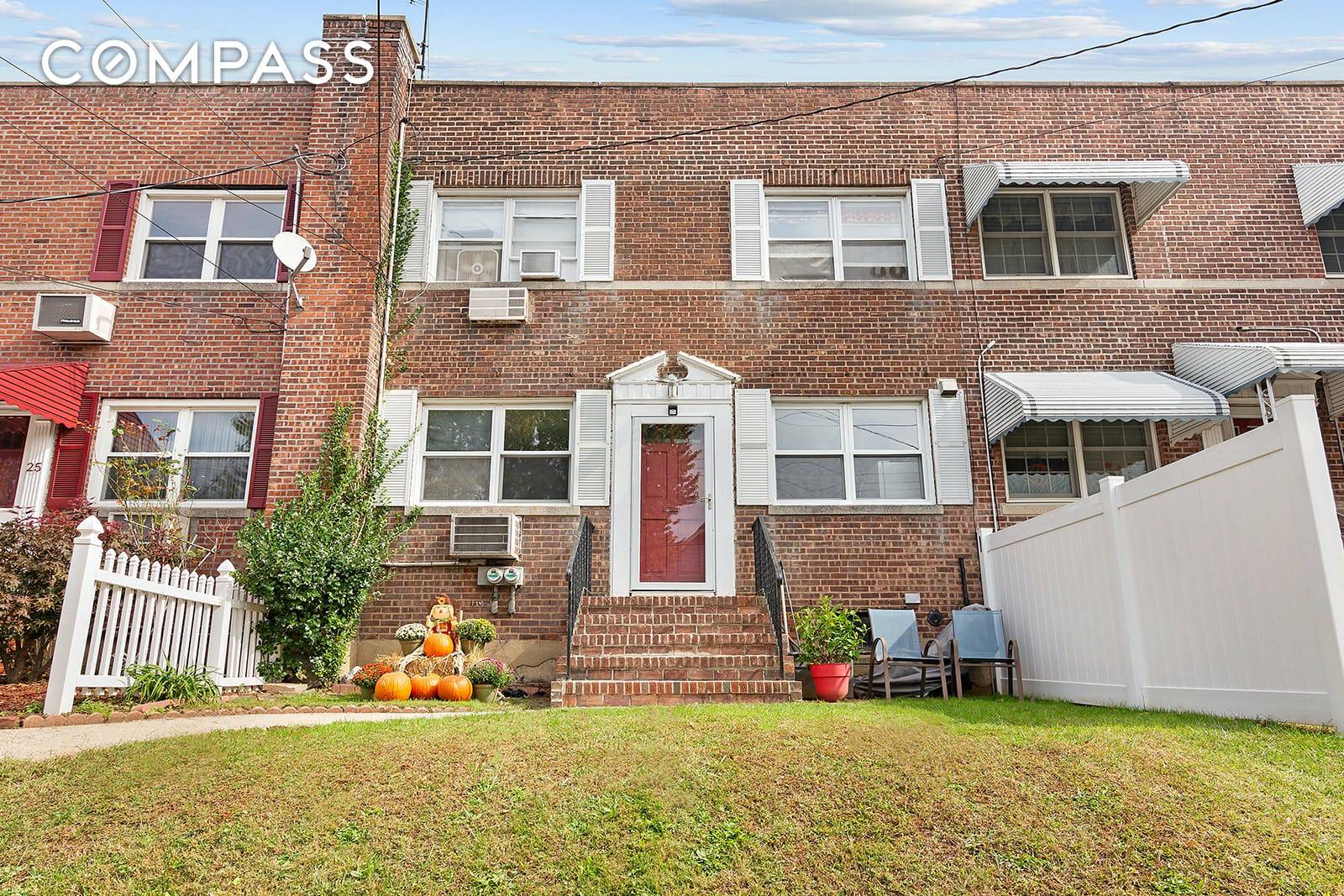 This handsome two family brick row house features clean, bright interiors and private outdoor space in Staten Island's convenient Castleton Corners neighborhood.