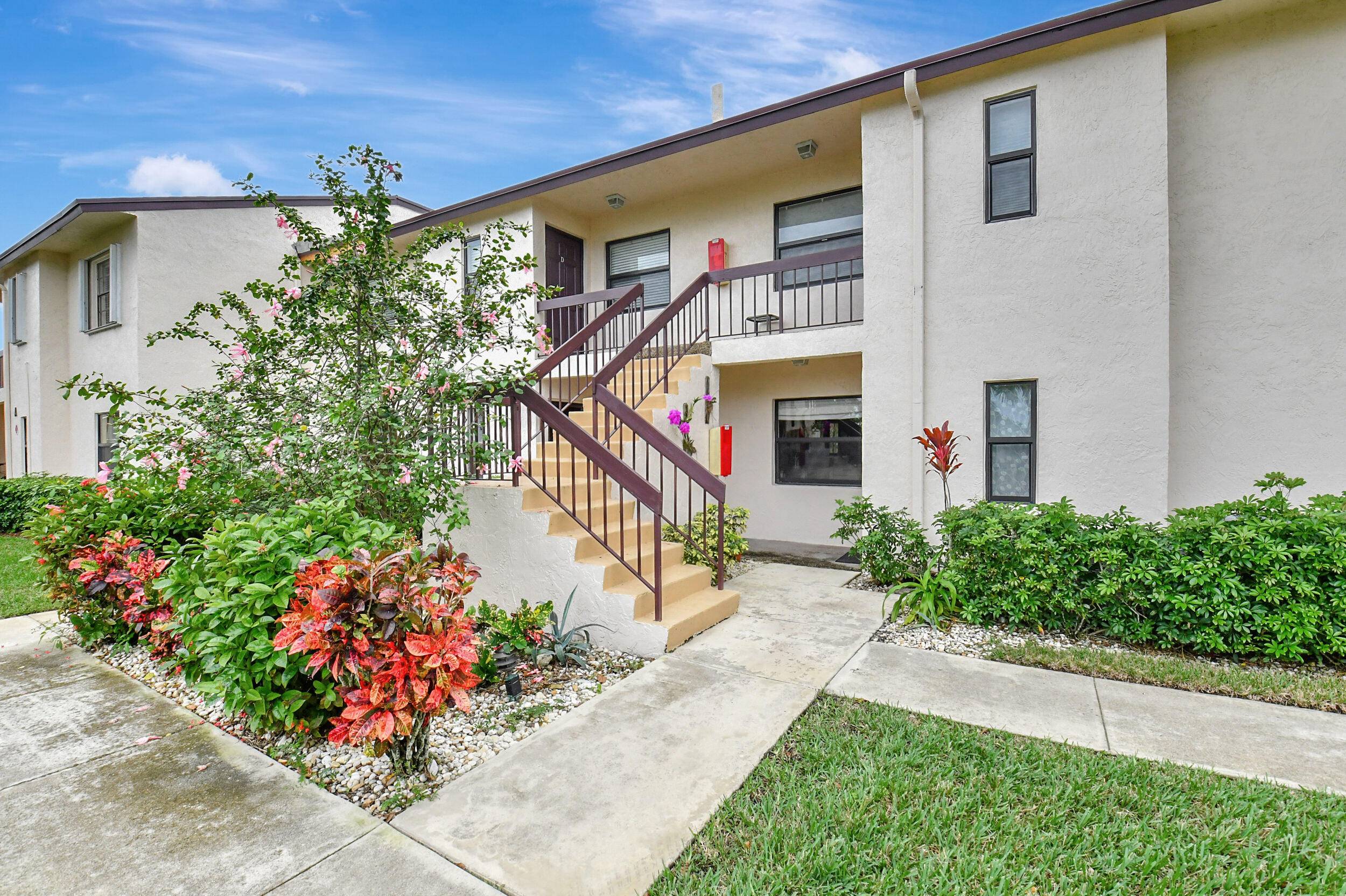 Welcome to 7911 Eastlake Drive, a ground floor 2 bed 2 bath condominium nestled in the serene Boca Lago Country Club, where membership is optional.