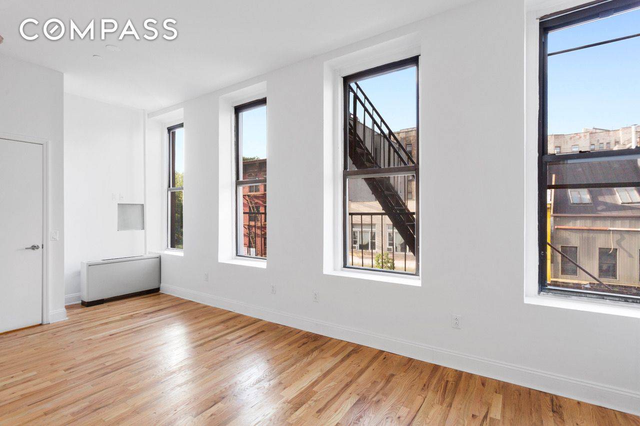 Massive Convertible 4, with 9 windows, a ton of exposed brick, newly envisioned half floor of a restored pre war loft building.
