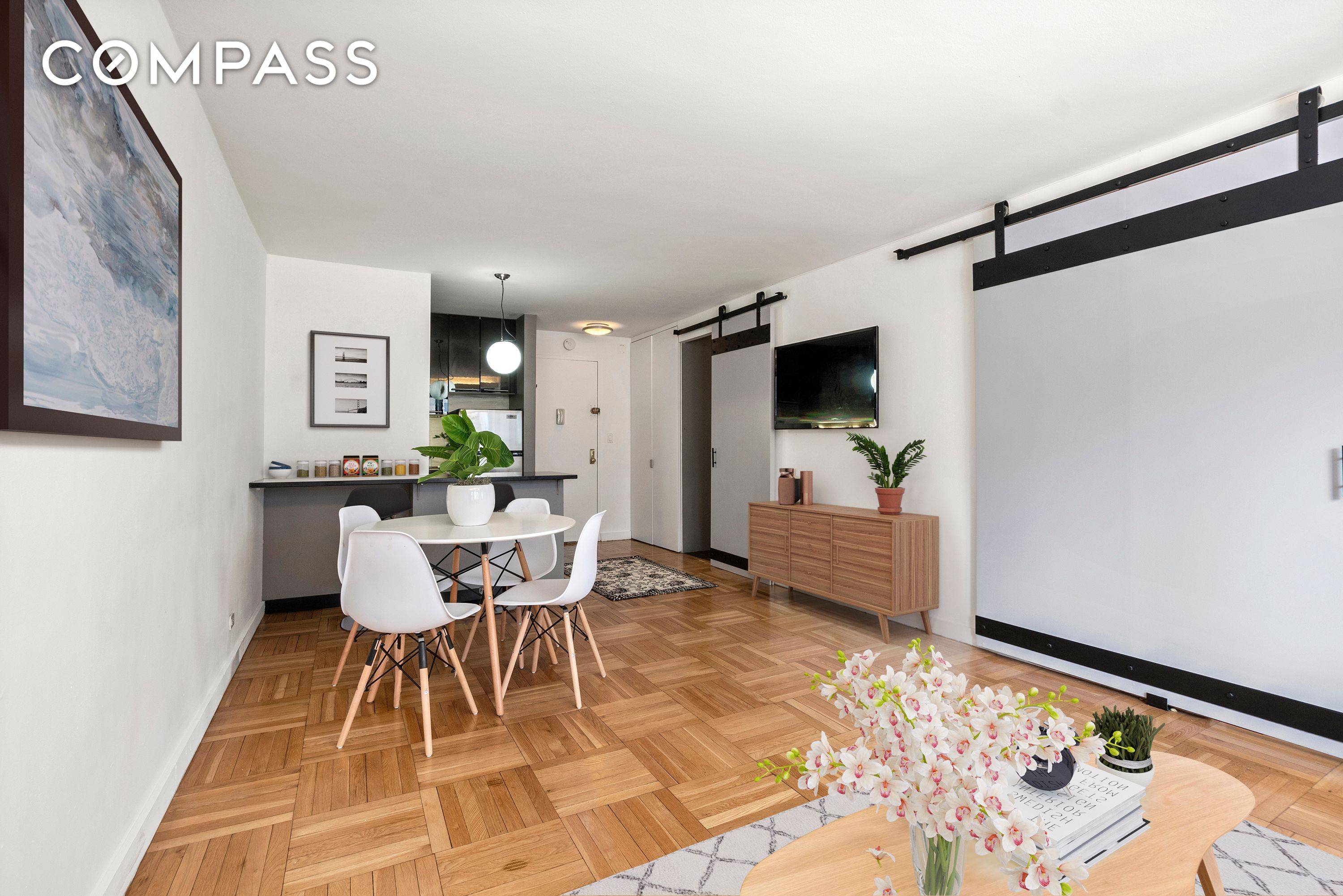 This bright and spacious Corner One Bedroom exudes character and uniqueness with its custom barn doors and distinctive layout.