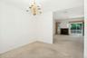 With view to living room with fireplace* & sliding glass doors to rear deck and yard*fireplace has not been used..