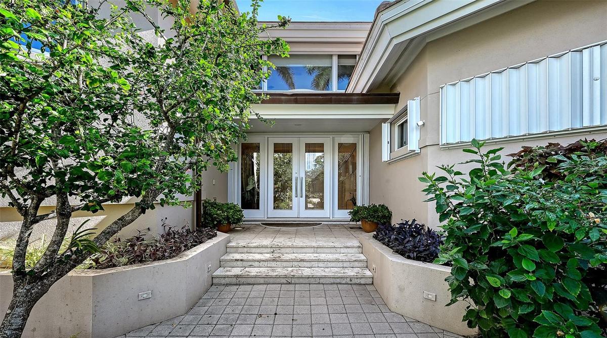 Front door entrance from a private, gated Harbor Section street