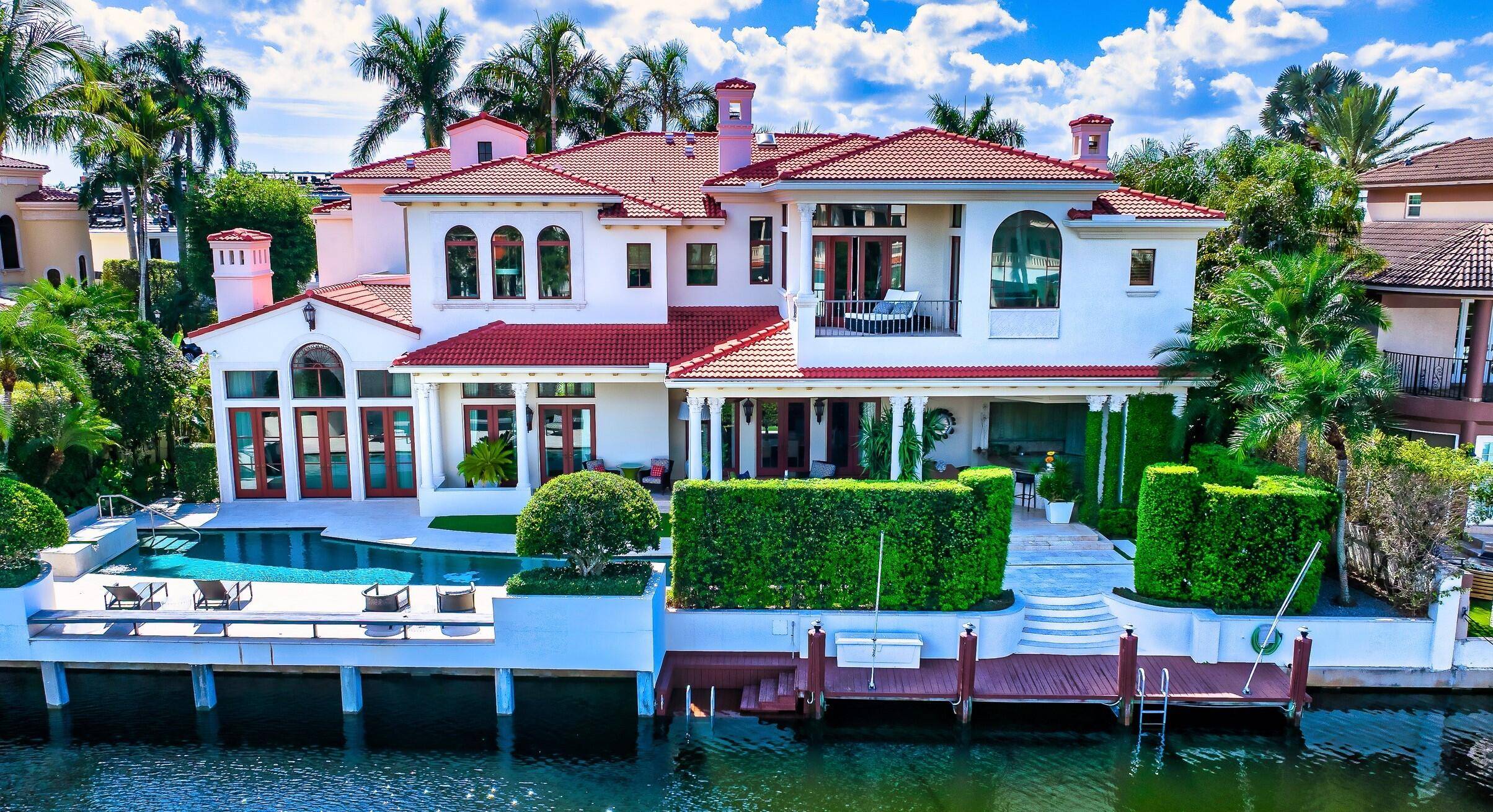 Chic Montecito style meets this Sanctuary deepwater estate sited on 116 feet of waterfrontage originally built by Palm Beach builder Addison Development and interiors by Marc Michaels.