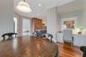 Dining space featuring crown molding and wood-type flooring