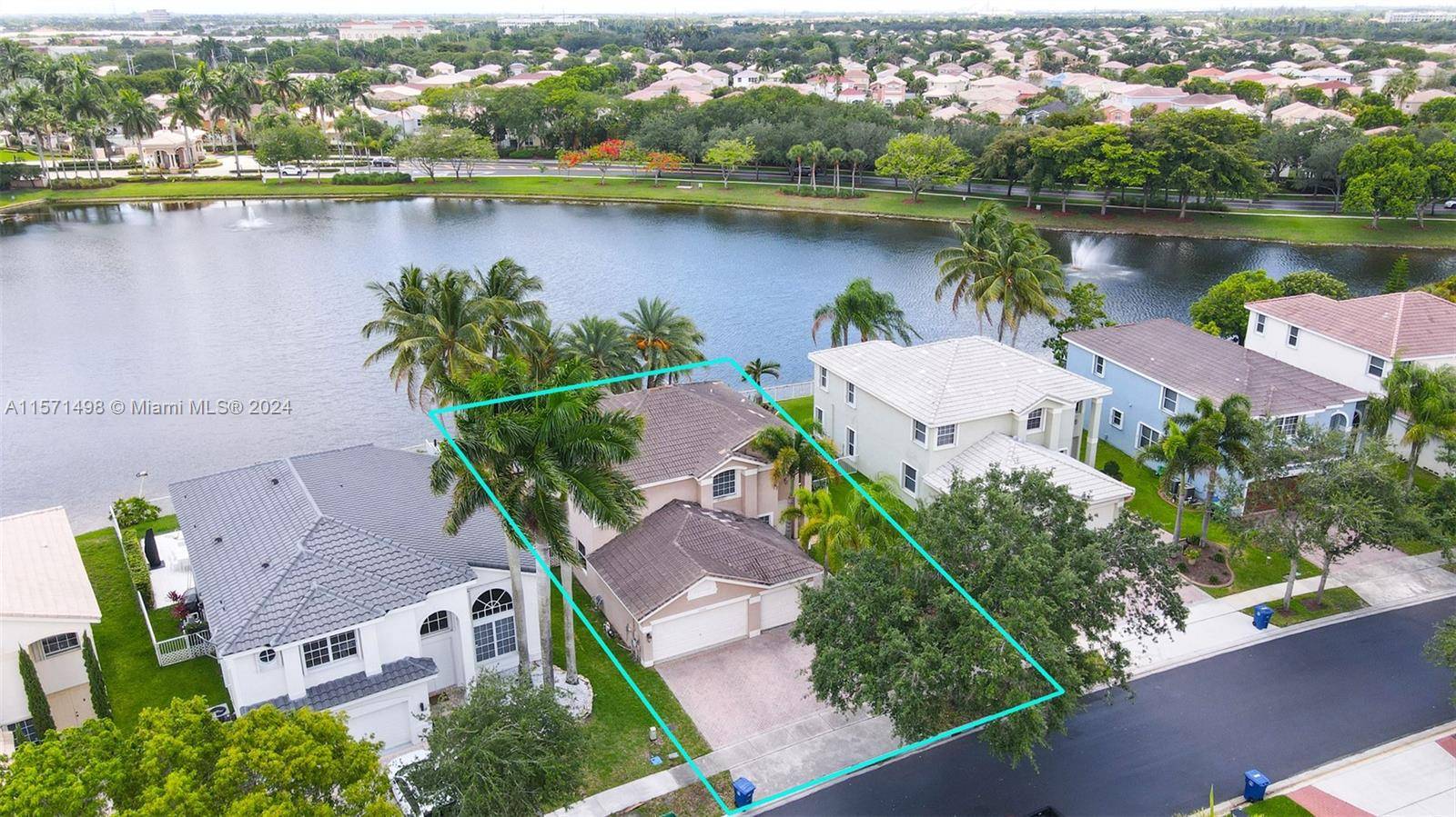 Spectacular 5 Bedroom 3 Bathroom Waterfront Home with Pool and 3 Car Garage.
