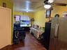 Living area with ceiling fan and cooling unit
