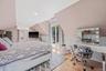 Bedroom featuring light wood-style floors, recessed lighting, wainscoting, vaulted ceiling, and an office area