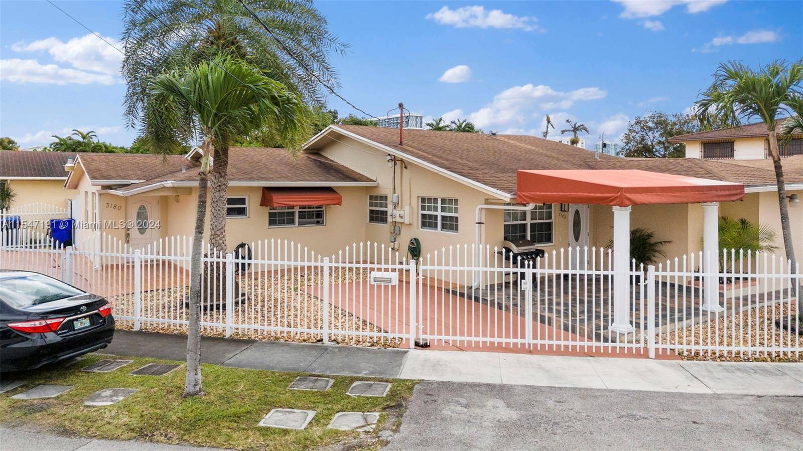 Explore Miami living in this corner lot duplex nestled between Coral Gables and Coconut Grove.