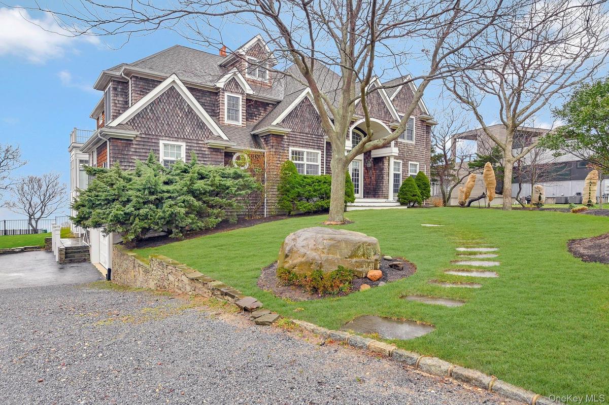 View of front of house with a front yard