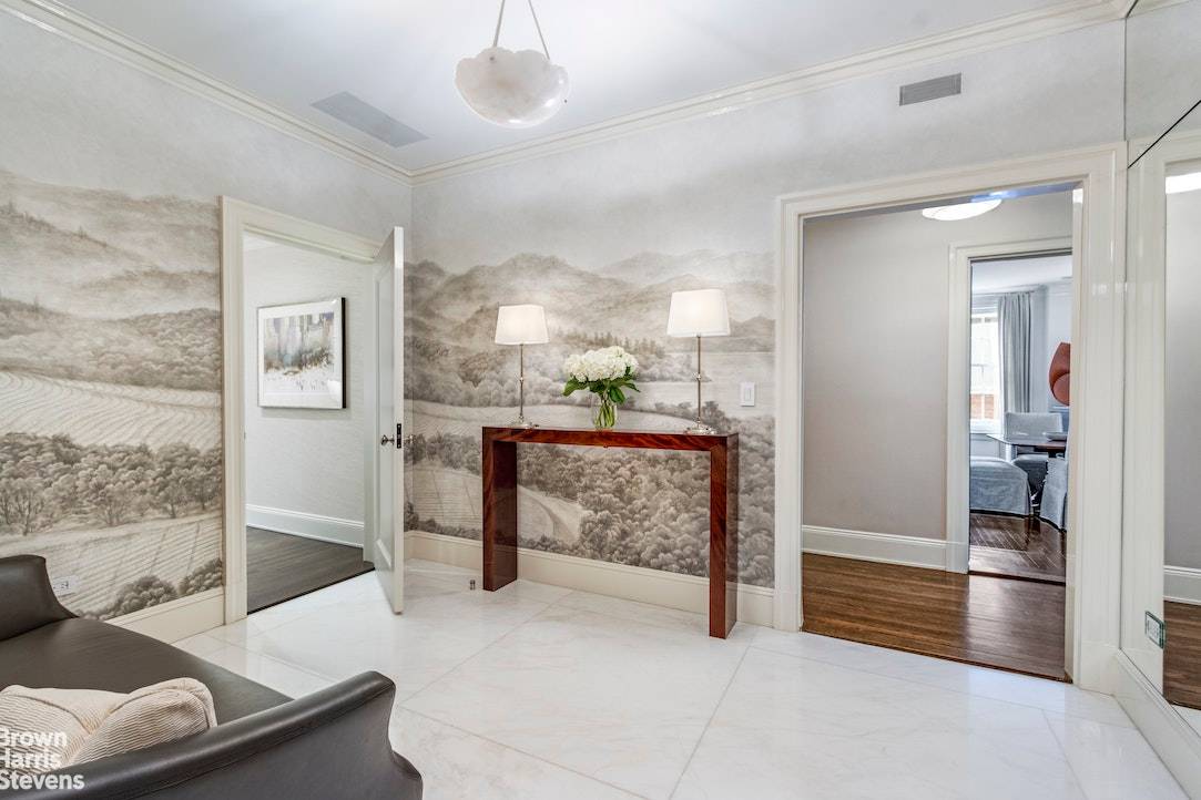 Located in a prestigious Park Avenue cooperative, this meticulously renovated and sun filled nine room residence showcases elegance at its finest.