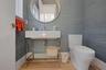 Bathroom with toilet, wood-type flooring, and sink