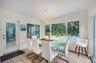 Dining area with seating for 8 and a view of the pool area