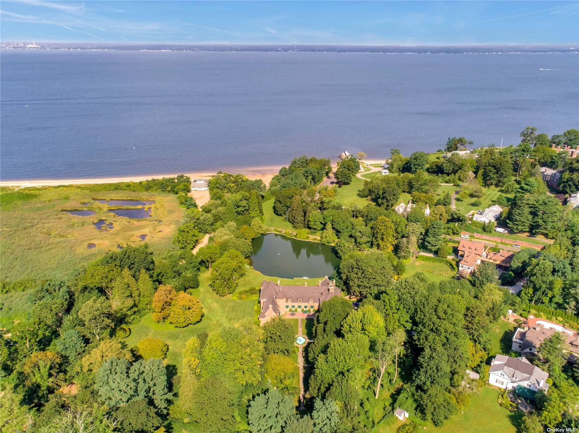 True Gold Coast Waterfront Estate on shy 9 acres Cobble Court offers direct access to private sandy beach with Association fee on Long Island Sound and unparalleled water views from ...