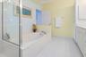 Primary Bath with separate tub, dual vanity and shower.