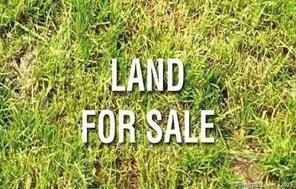 1 acre lot. Raw land. No approvals in place.
