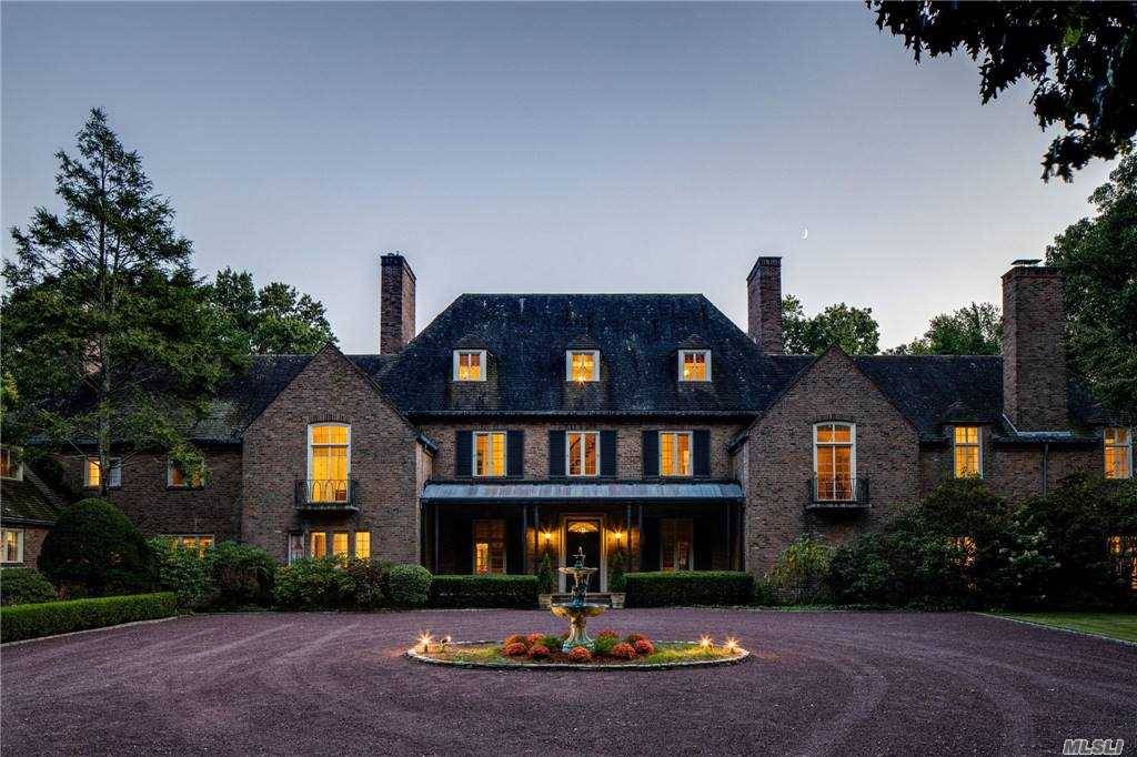 Behind gated entry and approached by a long private driveway, The Masterpiece Collection's Arden Manor spans majestically on approximately six lush, green acres in Harriman Estates, Sands Point.