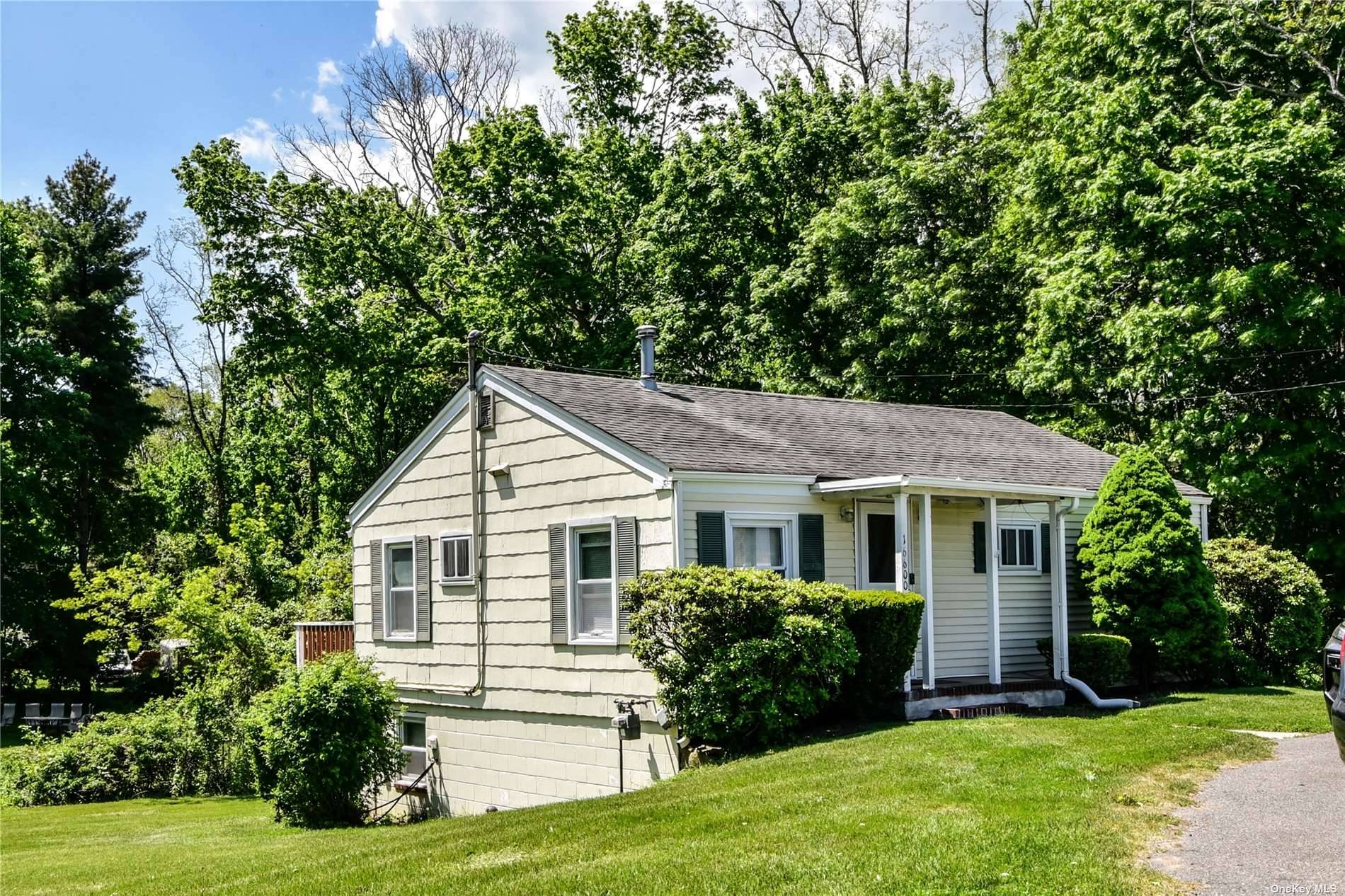 North Fork Charm Cozy 3 Bedroom Ranch Which Features Eat in Kitchen Dining Area, Living Room, Deck Great For Entertaining, Full Basement w Walk Out amp ; Full Bath.