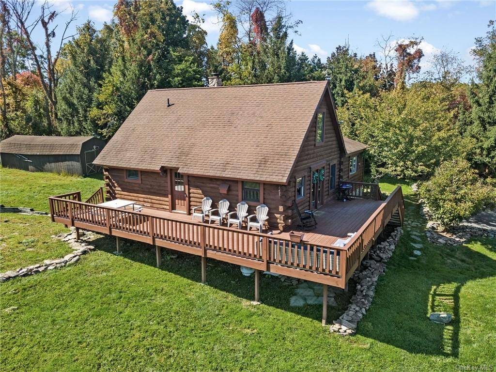 BEAUTIFUL LOG HOME WITH HEATED DETACHED GARAGE This is the one !