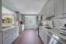 Updated kitchen with outdoor exit to backyard