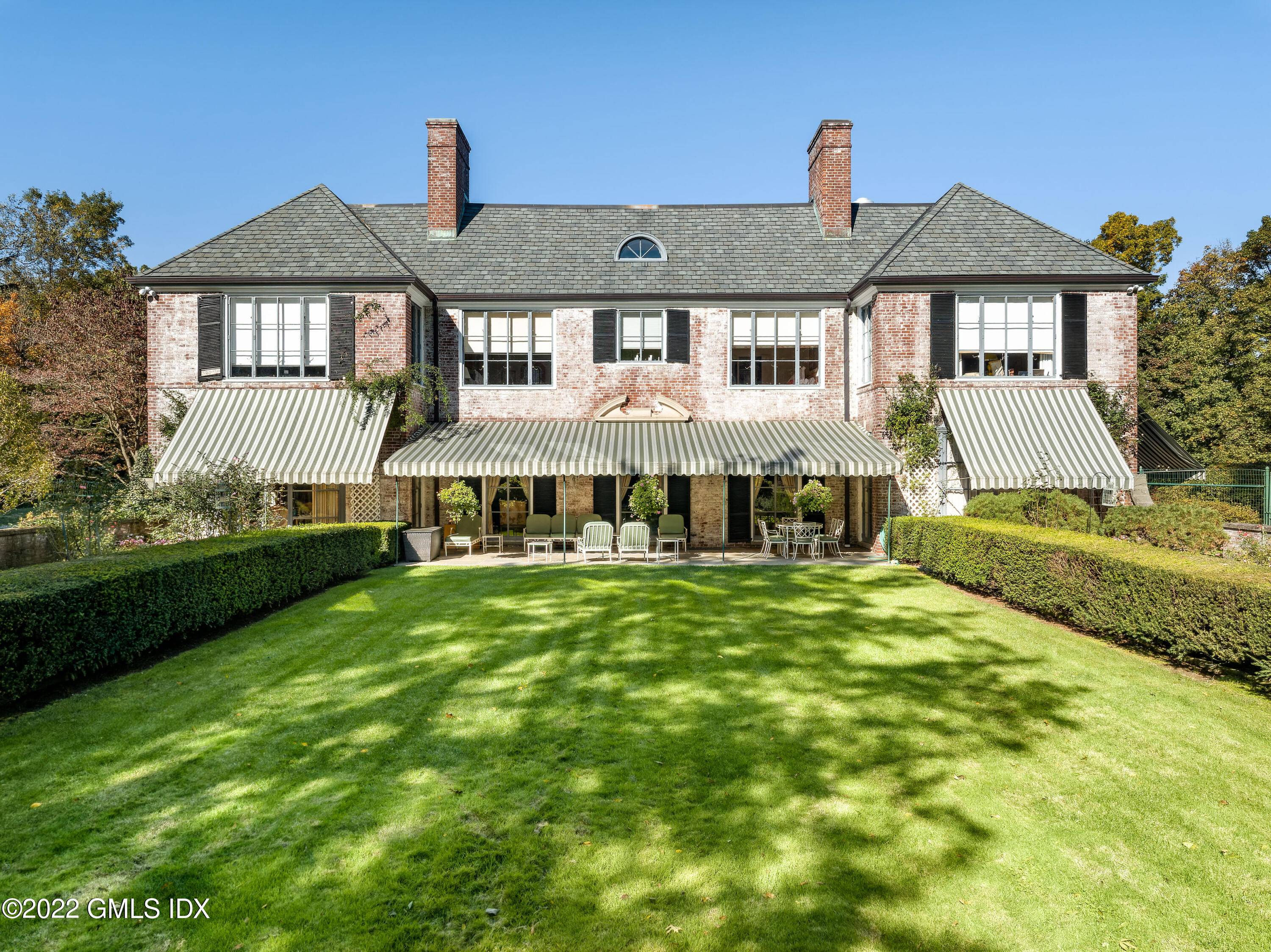 Beautifully situated on 8 acres is this classic 1929 Georgian brick manor near town.