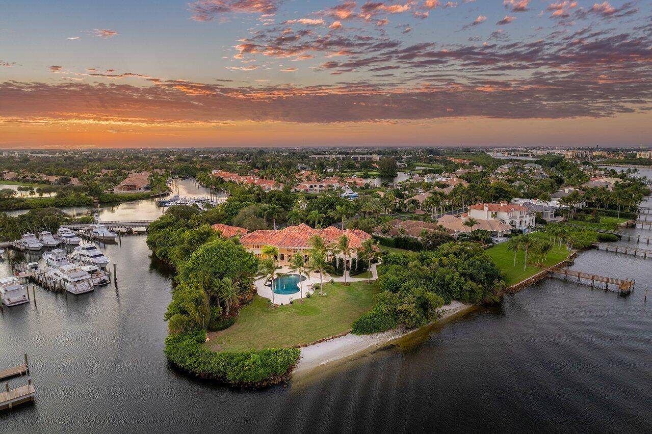 Welcome to 3208 Pilots Point Circle, one of the most exquisite, private, waterfront estates in all of Jupiter.