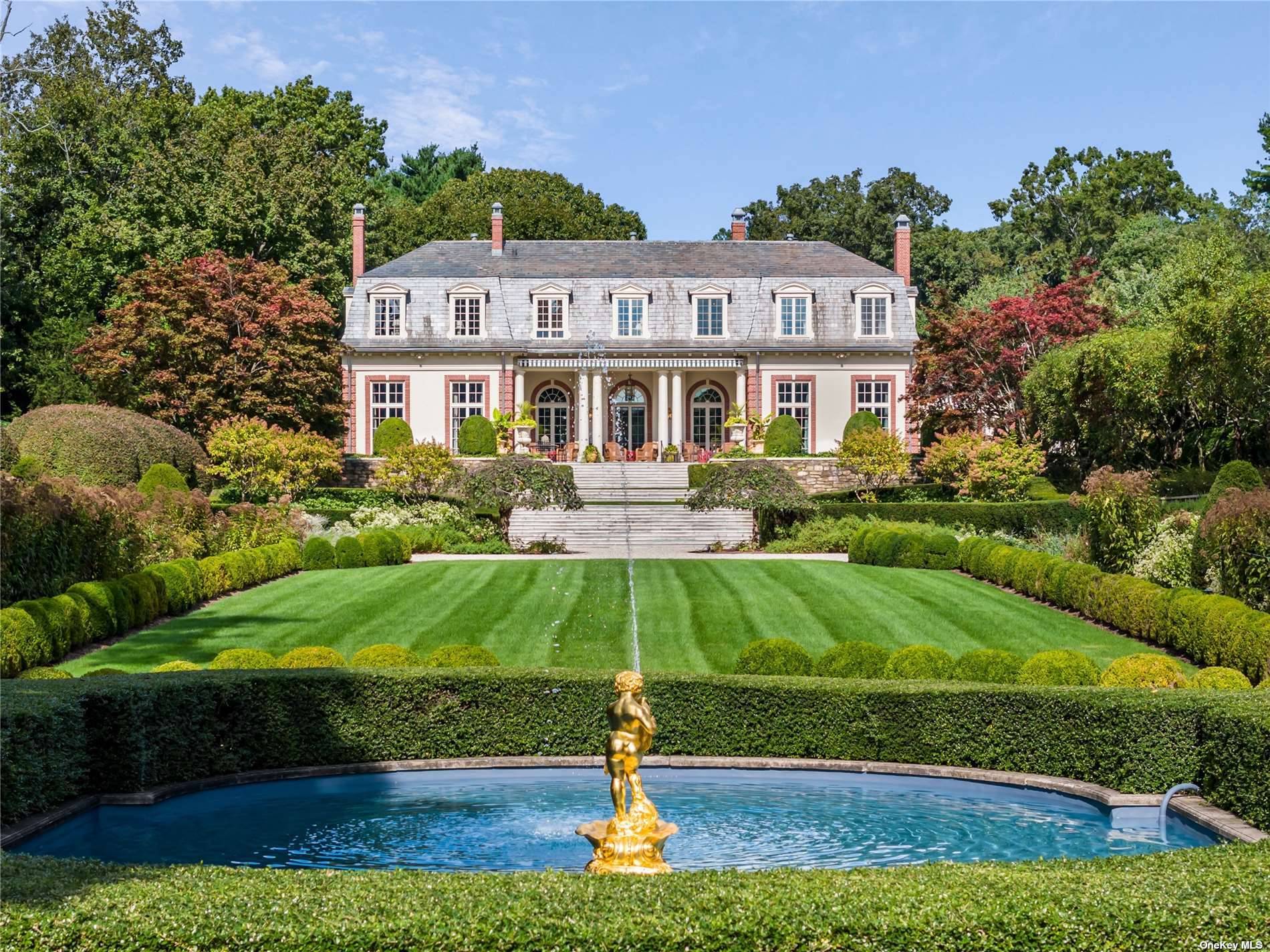 'Haut Bois' is an elegant brick and stucco French Chateau located in the heart of Brookville, NY.