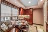 Dining room with inlaid floor details, recessed lighting, light tile patterned floors, and a tray ceiling