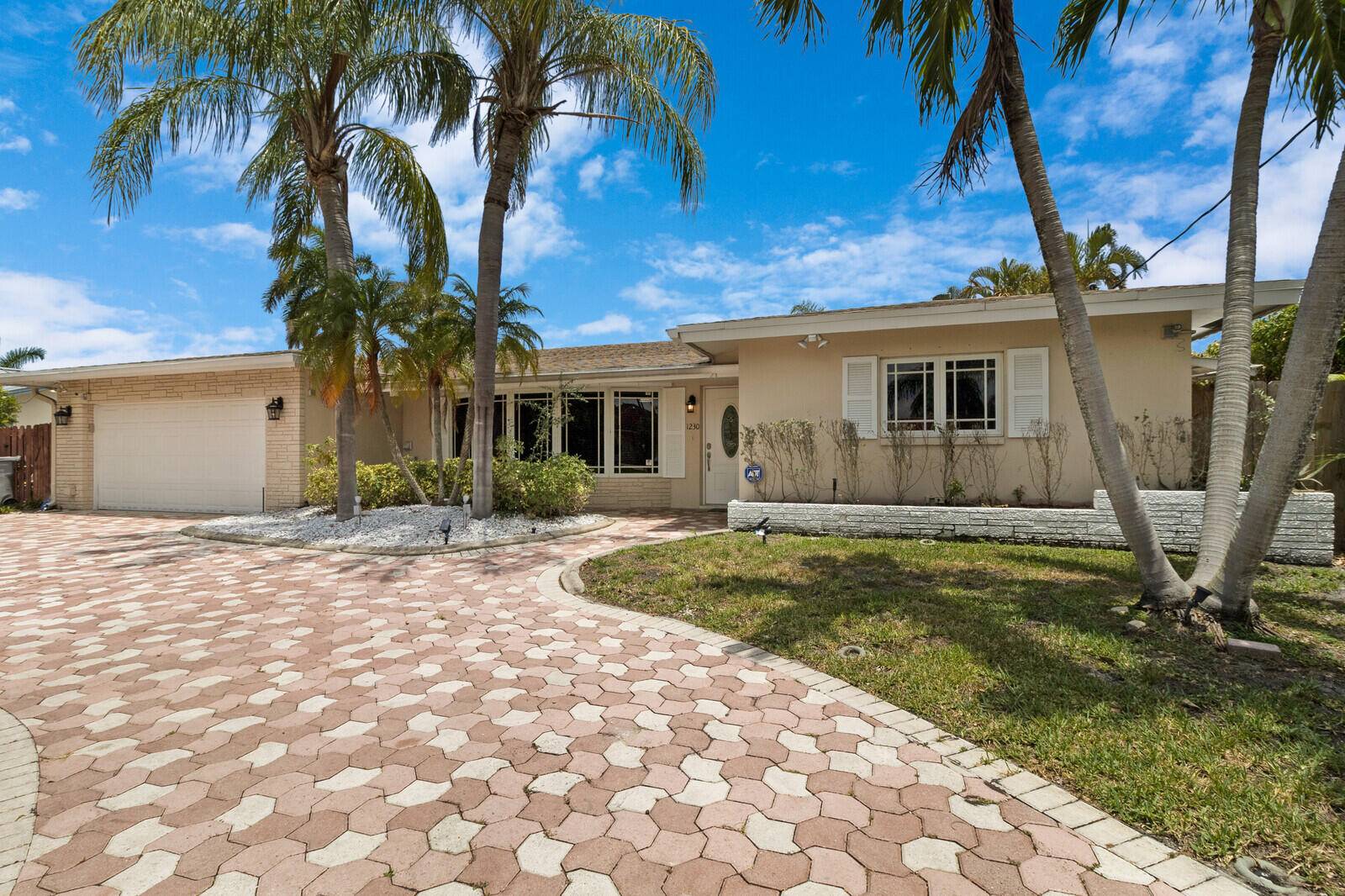 DON'T WAIT to see this 80' WATERFRONT HOME in coveted COUNTRY CLUB ISLES.