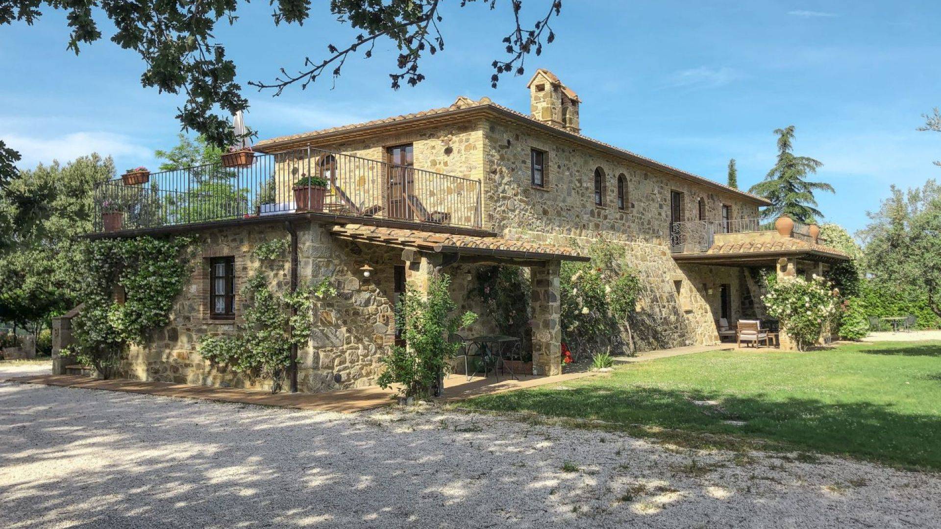 Stylishly 16th century stone farmhouse restored with 6 flats and pool for sale in Val d'Orcia, Tuscany