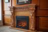 Elegant carved marble fireplace adds warmth and sophistication to this handsome study.