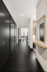 Hall with dark hardwood / wood-style flooring
