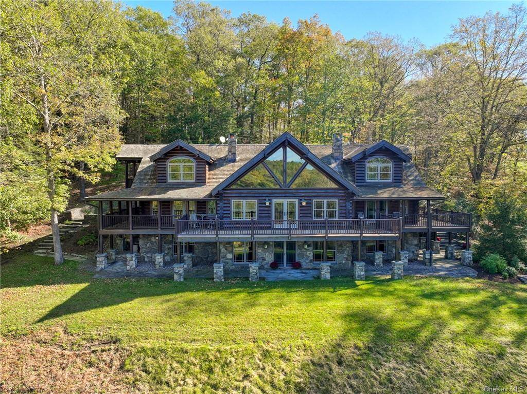 This Breathtaking Custom Log Estate was commissioned by the current owners in 2003, and the Custom Stone and Cedar Guest Home built in 2006 is simply indescribable.