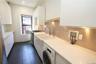 Laundry area with washer / dryer, dark tile patterned floors, and recessed lighting