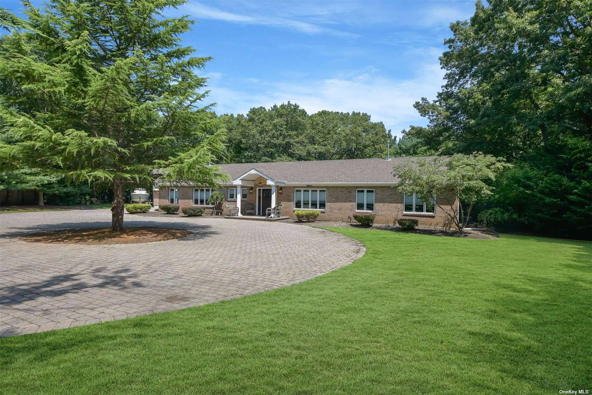 Welcome to this exquisite all brick ranch nestled on 2 acres of property in the heart of Mount Sinai.