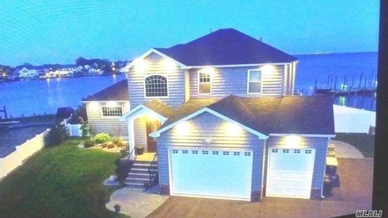 Jump into 2021 in this Spectacular Unparalled Custom Built Energy Star Cove Bayfront Home Sitting on a Quiet Cul De Sac.