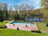 Infinity pool overlooking private lake