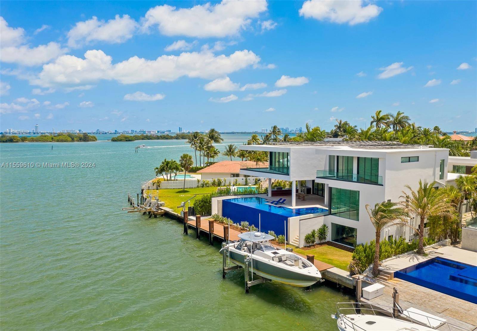 Stunning Bay Canal Contemporary Residence 100 ft on deep water New Construction total of 12, 200 SF under A C.