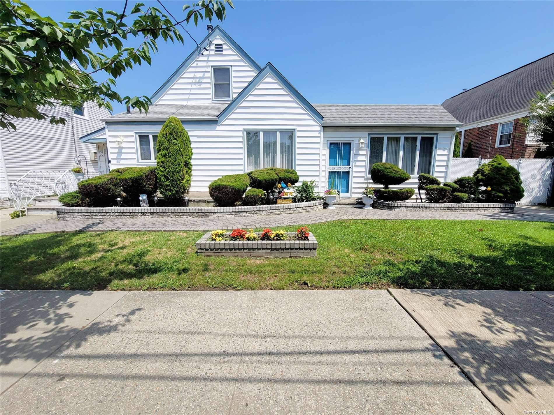 Extremely wide set four bedroom three full bath property in New Howard Beach.