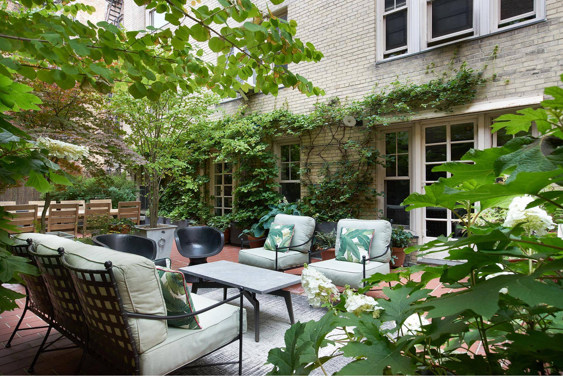 A MUST SEE GUT RENOVATED JEWEL BOX TWO BEDROOM TWO BATHROOM WEST VILLAGE FULL SERVICE CONDOMINIUM HOME WITH AN EXTENSIVE PRIVATE GARDEN !